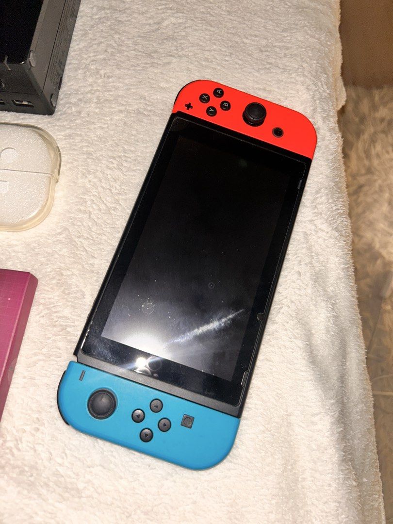 Nintendo Switch v1 - No issues/All Authentic + Acessories (Category: Nintendo) located in Manila. Submitted by kashrain (Listing ID 1468120391, Image 3). Description: Nintendo Switch v1 - No issues/All Authentic + Acessories CONDITION & DETAILS: 128GB All Authentic Fully working, no known issues — no drift, no deadpixels No scratches Original Blue and Red Joy-Cons Not Jailbroken No box Just bubbles on the screen protector hehe INCLUSIONS: NO BOX 