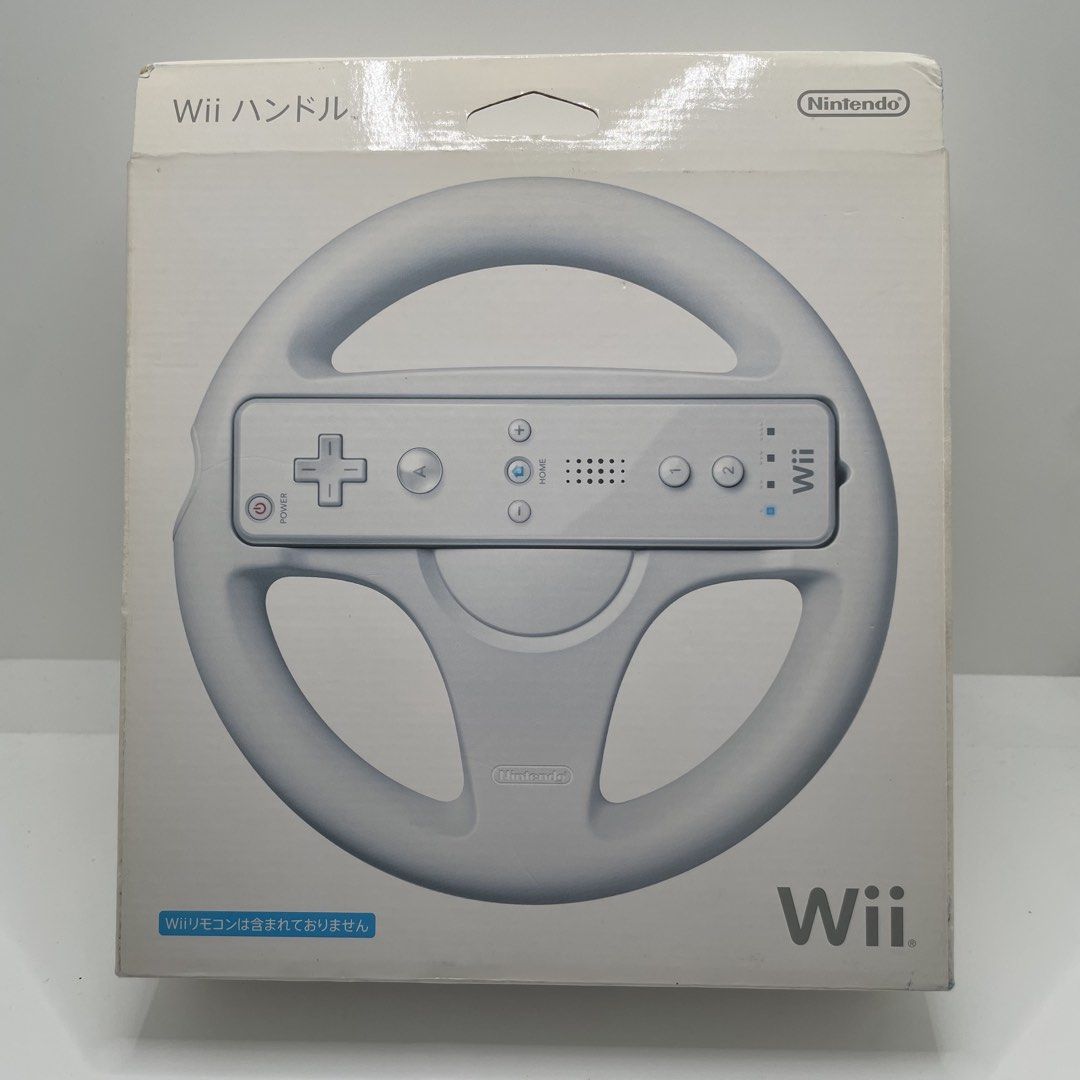 Nintendo Wii Wheel Controller Attachment Handle (Category: Controllers) located in Mandaluyong City. Submitted by akihabara48 (Listing ID 1468134466, Image 1). Description: Boxed Excellent Condition Seems Unused Untested Unsealed Only - Official Nintendo Wii Wheel (White) - Japanese import version - Ideal for Mario Kart and other racing games - Fits standard Wii Remote perfectly - Box opened for photos only, contents still in original plastic - M