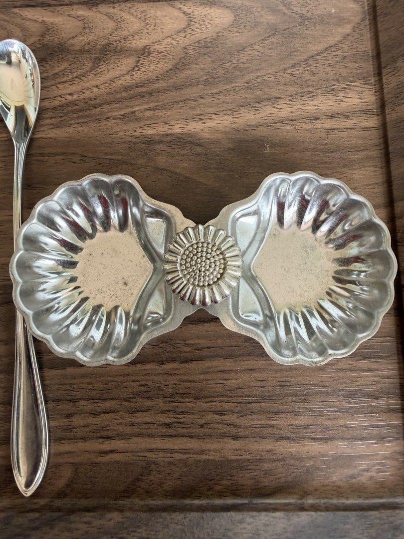 Noritake Stainless Shell Design Serving Set with Double Dish (Category: Dinnerware & Cutlery) located in Digos. Submitted by old_soul. (Listing ID 1468098866, Image 2). Description: - Authentic Noritake stainless steel set - Features a unique double seashell-shaped serving dish joined by a sunflower emblem - Includes 3 matching spoons: 1 large serving spoon, 1 shell-shaped spoon, and 1 long-handled spoon - Stainless stamp on the back for authenti