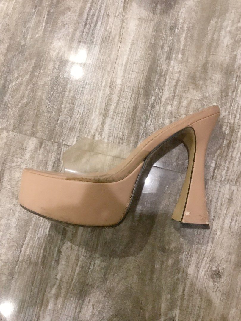 Nude Platform Clear Strap Heels (Category: Heels) located in Manila. Submitted by sparkfinds (Listing ID 1468243050, Image 1). Description: - Style: Nude platform mules with thick flared heels and clear transparent toe straps - Color: Neutral beige (goes with any outfit) - Comfort: Chunky platform design for easier walking - Condition: Pre-loved, worn multiple times - Flaws: Noticeable scuffs and peeling on the heel bases and platform edges, with