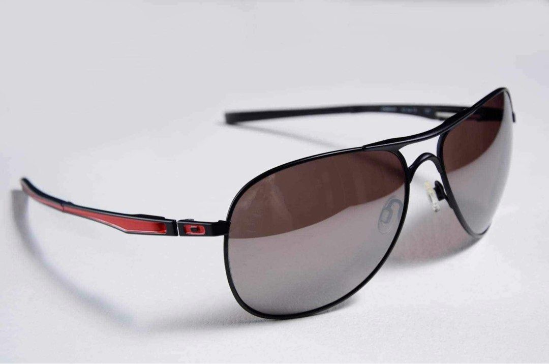 Oakley Plaintiff Polarized Sunglasses (Category: Sunglasses & Eyewear) located in Pasig City. Submitted by shifter168 (Listing ID 1468092926, Image 1). Description: Authentic and brand new old stock Selling low - Brand: Oakley Plaintiff - Color: Matte black with red accents - Lenses: Polarized for zero glare and crystal clear vision - Frame Shape: Aviator - Condition: Pristine, zero scratches or wear marks - Inclusions: Complete set with original