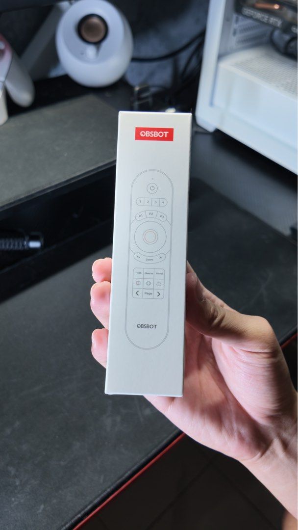 OBSBOT Remote Control (Category: Webcams) located in Ampang. Submitted by isellmystuff69 (Listing ID 1468093580, Image 1). Description: - Authentic OBSBOT remote control in original white box - Compact and lightweight design for easy handling - Full controls: power, zoom, tracking, and preset buttons - Brand new straight from packaging - Perfect accessory for effortless long-distance camera control.