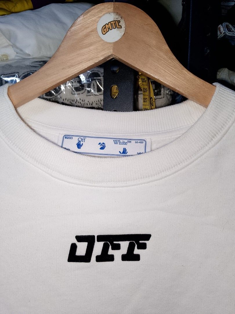 Off-White White Crewneck Sweatshirt Size M (Category: Coats, Jackets and Outerwear) located in Manila. Submitted by mjthrifted_second (Listing ID 1468073225, Image 3). Description: - Brand: Off-White - Item: Crewneck Sweatshirt - Color: White - Size: M (Tagged with interior product code) -Dimes: 20/25 - Material: 100% Cotton - Origin: Made in Portugal - Design: Logo embroidery on chest, ribbed cuffs and hem - Style: Classic streetwear.