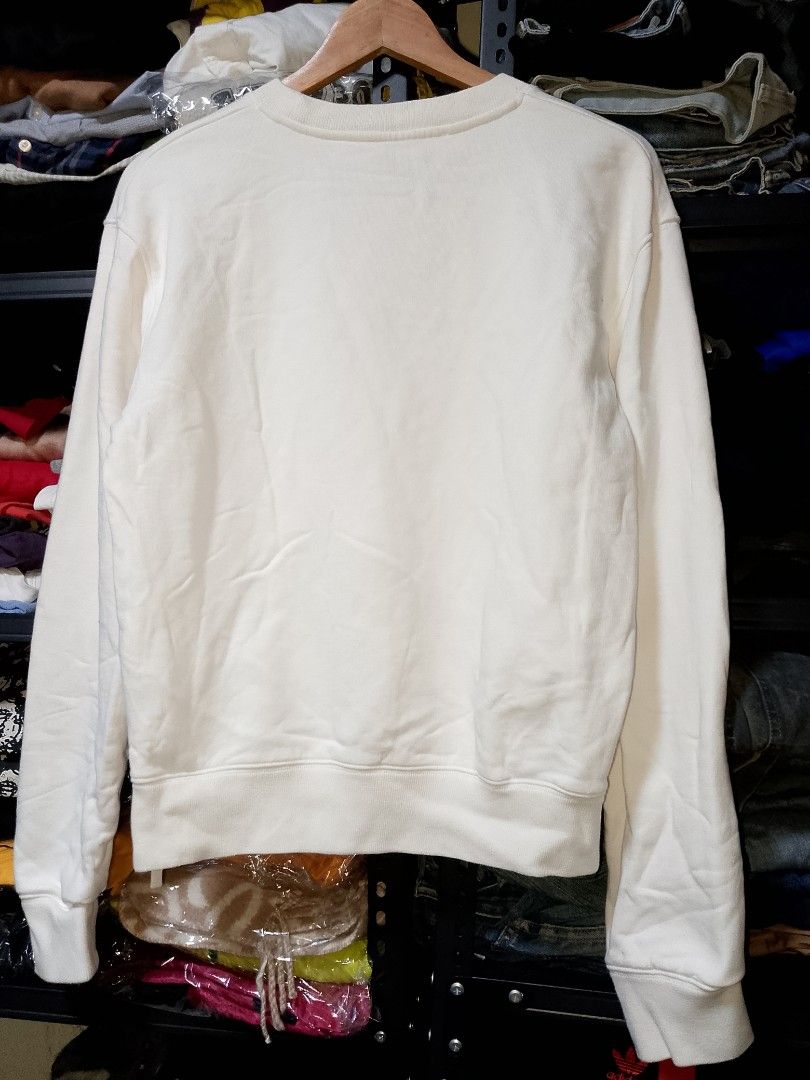 Off-White White Crewneck Sweatshirt Size M (Category: Coats, Jackets and Outerwear) located in Manila. Submitted by mjthrifted_second (Listing ID 1468073225, Image 2). Description: - Brand: Off-White - Item: Crewneck Sweatshirt - Color: White - Size: M (Tagged with interior product code) -Dimes: 20/25 - Material: 100% Cotton - Origin: Made in Portugal - Design: Logo embroidery on chest, ribbed cuffs and hem - Style: Classic streetwear.