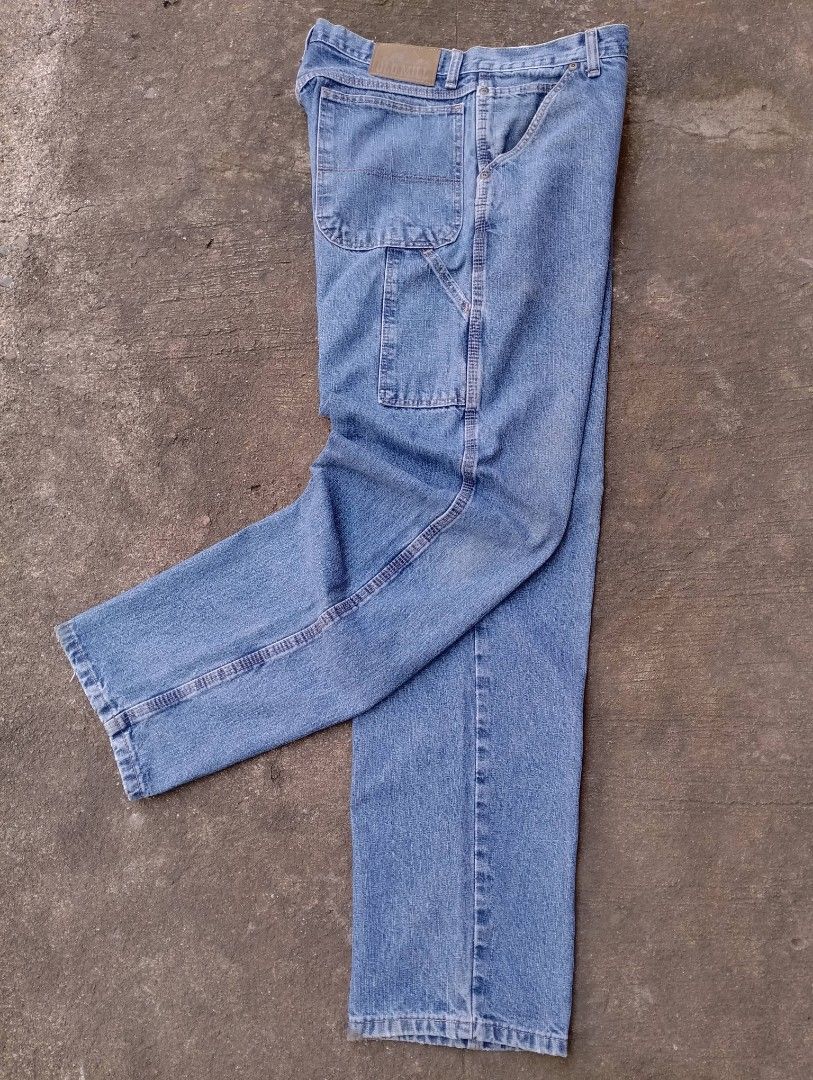 Old Mill Carpenter Denim Jeans (Category: Jeans) located in Bago City. Submitted by the_outcast6101 (Listing ID 1468278588, Image 2). Description: - Brand: Old Mill - Style: Classic straight leg carpenter jeans - Color: Light wash denim - Features: Utility side pocket, hammer loop, YKK zipper fly, and branded metal button - Details: Leather patch on the back waistband and standard belt loops - Material: Durable cotton construction - Condition: Ex