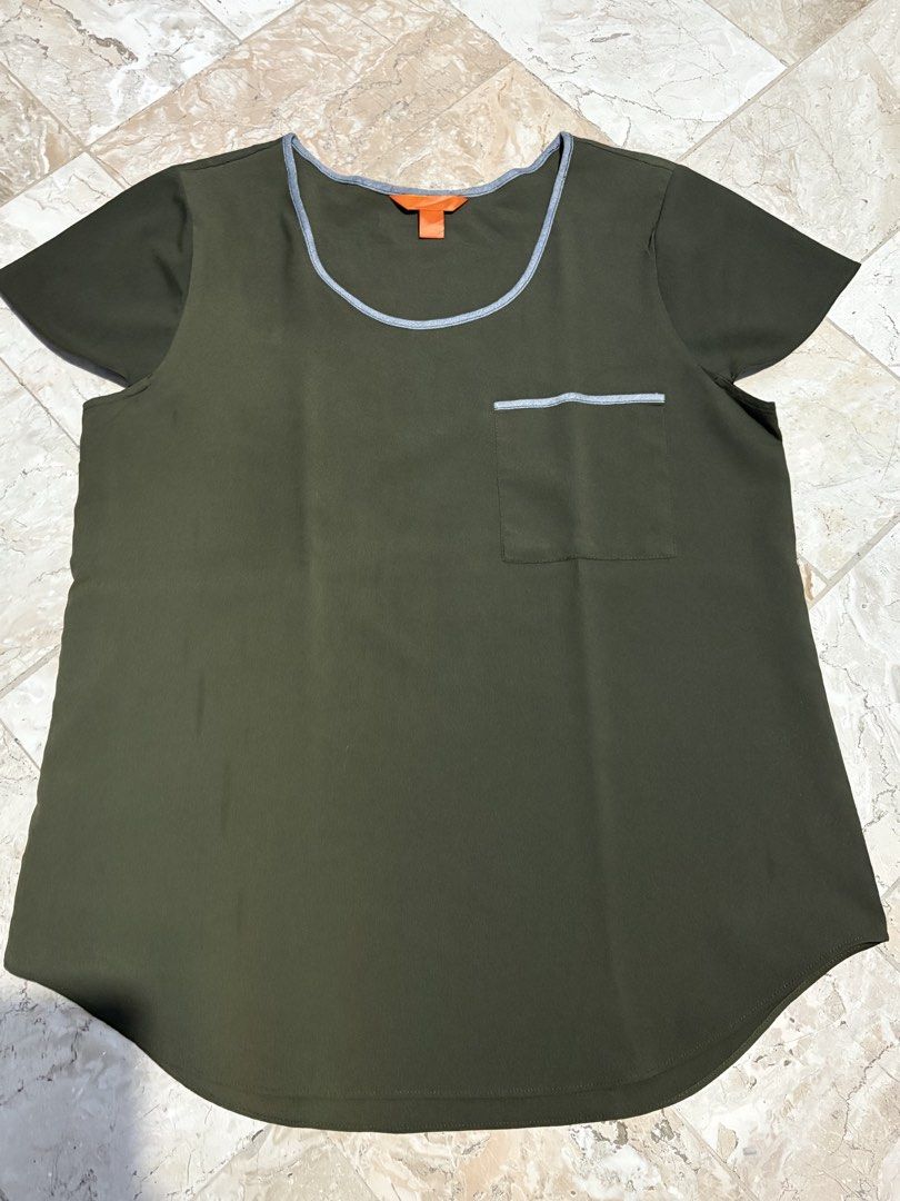 Olive Green Short Sleeveless Blouse (Category: Blouses) located in Bulacan. Submitted by franchesca_vg (Listing ID 1468174637, Image 3). Description: - Color: Olive green - Style: Short-sleeve blouse with scoop neckline - Size: Small to Medium - Details: Silver trim along the collar and chest pocket - Lightweight fabric (thin).