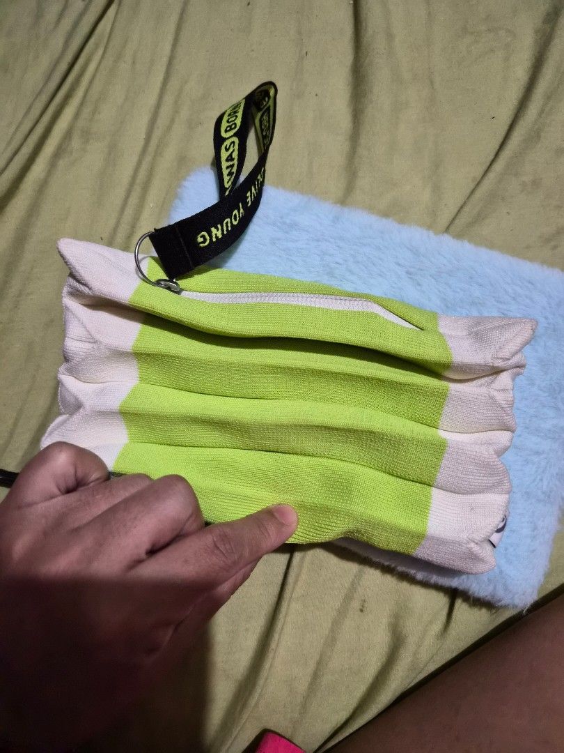 Olive Young HBD Edition 2024 Pouch Green White (Category: Purses & Pouches) located in Mandaue City. Submitted by chuchi152615 (Listing ID 1468148942, Image 3). Description: - Authentic Olive Young HBD Edition 2024 pouch - Trendy green and white striped ribbed knit material - Secure zipper closure down the side - Includes a black wrist strap with printed text - Features an eye logo tag on the inner seam - Comes with a soft fuzzy blue backing pad.