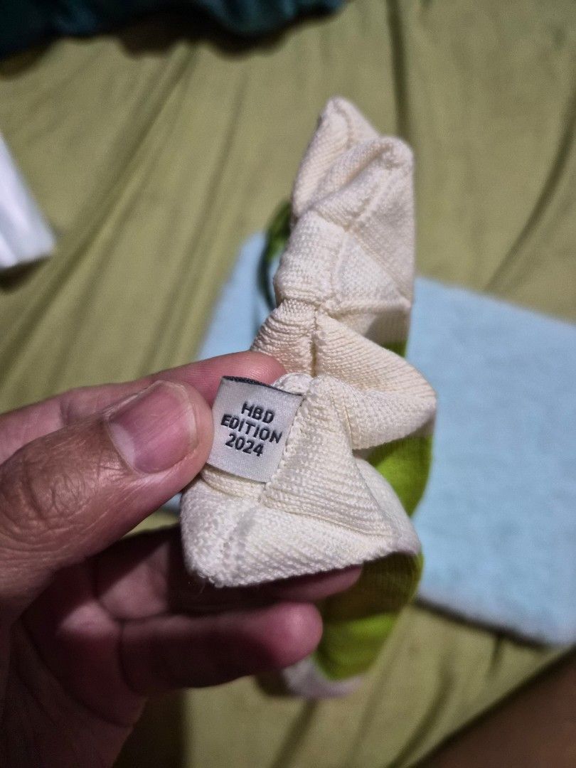 Olive Young HBD Edition 2024 Pouch Green White (Category: Purses & Pouches) located in Mandaue City. Submitted by chuchi152615 (Listing ID 1468148942, Image 2). Description: - Authentic Olive Young HBD Edition 2024 pouch - Trendy green and white striped ribbed knit material - Secure zipper closure down the side - Includes a black wrist strap with printed text - Features an eye logo tag on the inner seam - Comes with a soft fuzzy blue backing pad.