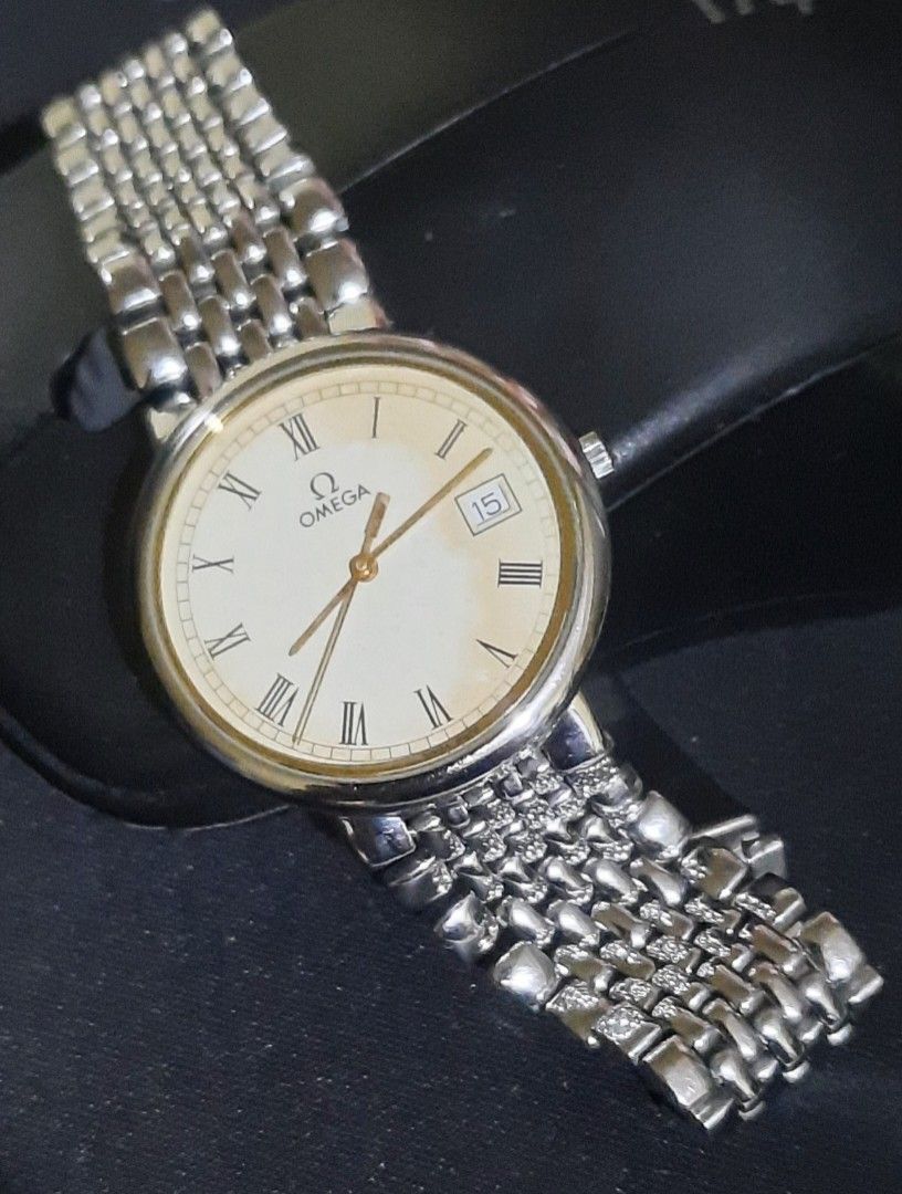 Omega De Ville Quartz Watch (Category: Luxury Watches) located in Bulacan. Submitted by ricoalba0697261 (Listing ID 1454147223, Image 2). Description: - Omega De Ville watch - Cream dial with Roman numerals - Date window at 3 o'clock - Stainless steel bracelet with signed clasp - Watch is running condition -sapphire crystal up to 6.8in.wrist.