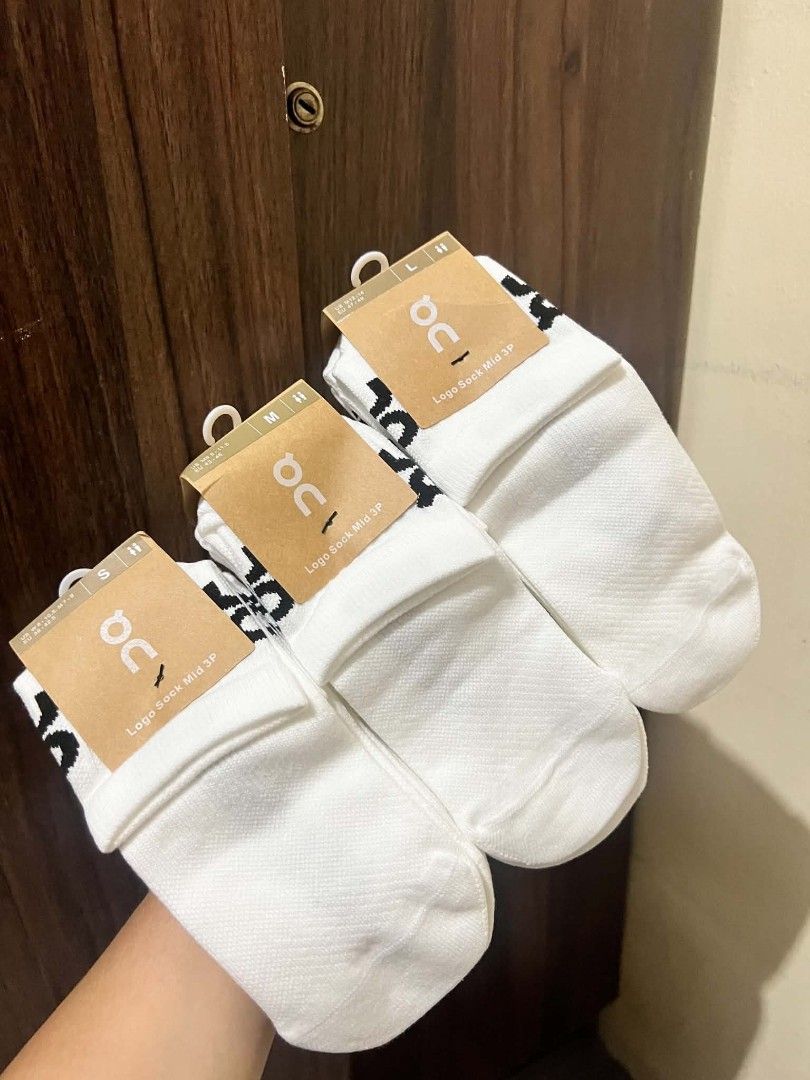 On Running Logo Sock Mid White (Category: Socks) located in Quezon City. Submitted by maynardshop (Listing ID 1468123634, Image 2). Description: - Brand: On Running - Style: Logo mid socks with clean ribbed design and bold black lettering - Color: White - Condition: Brand new, unworn with original tags attached on cardboard hangers - Material: Soft cotton feel - Sizes Available: S, M, and L.
