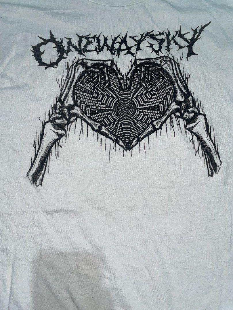 Onewaysky White Graphic Tee Skeleton Heart (Category: Shirts) located in Manila. Submitted by joshua_guimeroy. (Listing ID 1468215636, Image 2). Description: - Brand: Onewaysky - Color: White - Design: Large black graphic print with skeleton hands forming a heart, maze details, and barbed wire lettering - Fit/Style: Short sleeves, crew neck, great streetwear aesthetic - Material: Clean cotton fabric - Measurements: 20.5 inches chest width x 27.5 