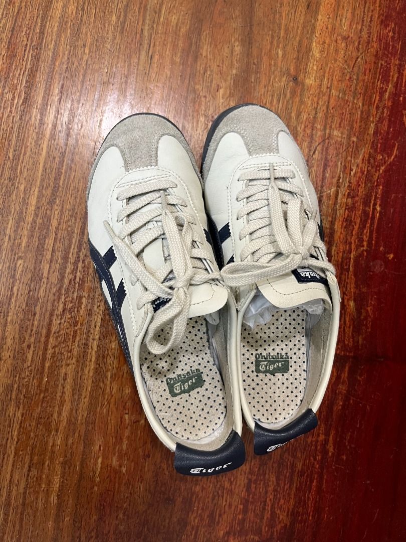 Onitsuka Tiger Mexico 66 White Navy (Category: Sneakers) located in Mabalacat. Submitted by applebottomjaens (Listing ID 1468109371, Image 2). Description: - Brand: Onitsuka Tiger Mexico 66 - Colorway: White and Navy Blue - Size: US 6.5 / EUR 39.5 / CM 25.0 - Condition: Clean uppers with minimal wear on outsoles - Style: Classic low-top with signature side stripes and suede overlays - Perfect for everyday casual wear and easy to match with any ou