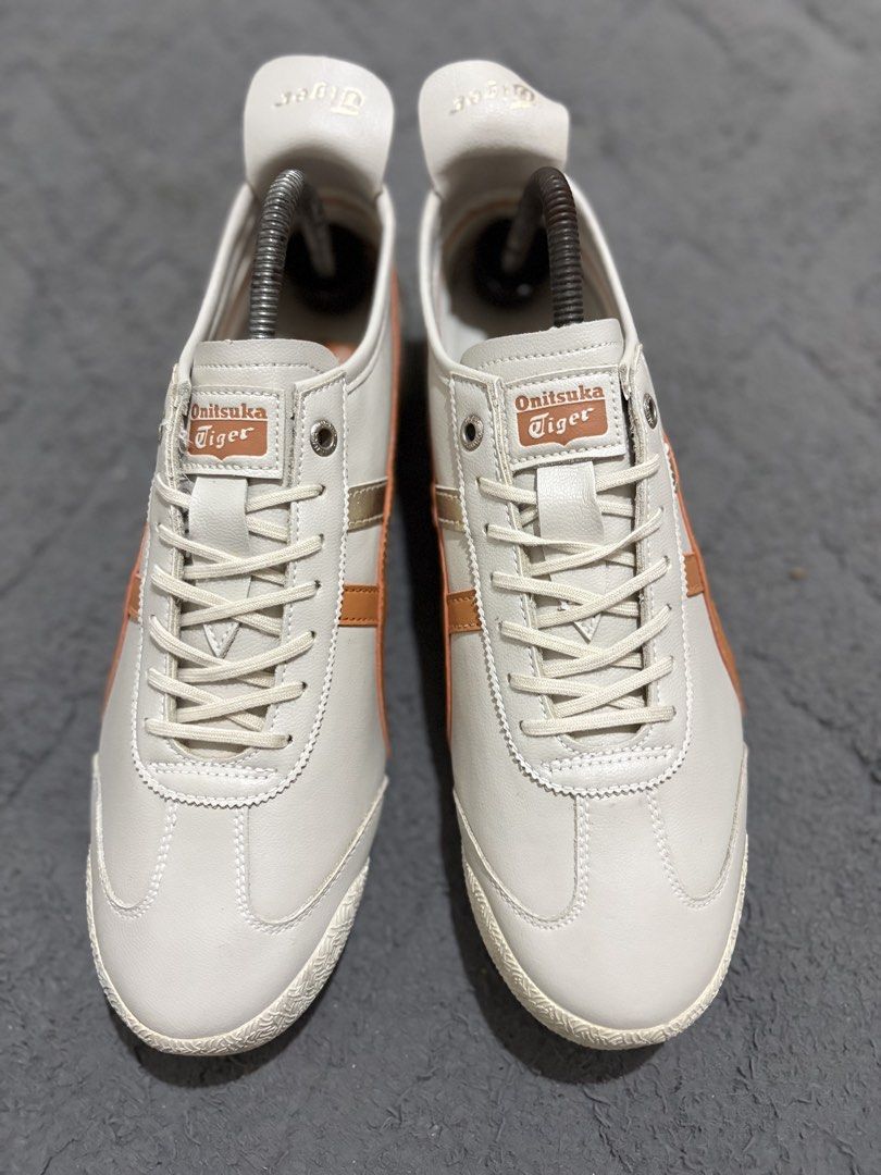 Onitsuka Tiger Mexico 66 White Orange Size US 8 (Category: Sneakers) located in Lapu Lapu. Submitted by jadegodine04736 (Listing ID 1468149199, Image 2). Description: - Model: Onitsuka Tiger Mexico 66 - Colorway: White and orange with silver stripes - Size: US 8 / EUR 41.5 / CM 26.0 (Made in Vietnam) - Material: Leather upper with textured rubber outsole - Condition: Clean overall with minimal wear on soles - Features: Iconic low-top silhouette w