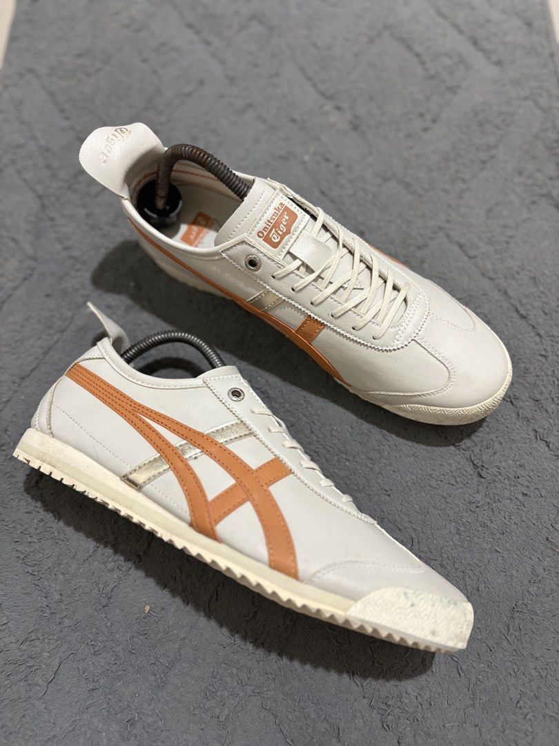Onitsuka Tiger Mexico 66 White Orange Size US 8 (Category: Sneakers) located in Lapu Lapu. Submitted by jadegodine04736 (Listing ID 1468149199, Image 1). Description: - Model: Onitsuka Tiger Mexico 66 - Colorway: White and orange with silver stripes - Size: US 8 / EUR 41.5 / CM 26.0 (Made in Vietnam) - Material: Leather upper with textured rubber outsole - Condition: Clean overall with minimal wear on soles - Features: Iconic low-top silhouette w