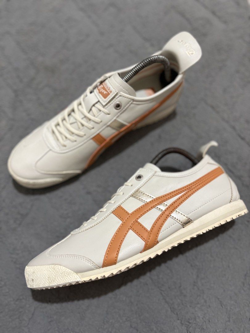 Onitsuka Tiger Mexico 66 White Orange Size US 8 (Category: Sneakers) located in Lapu Lapu. Submitted by jadegodine04736 (Listing ID 1468149199, Image 3). Description: - Model: Onitsuka Tiger Mexico 66 - Colorway: White and orange with silver stripes - Size: US 8 / EUR 41.5 / CM 26.0 (Made in Vietnam) - Material: Leather upper with textured rubber outsole - Condition: Clean overall with minimal wear on soles - Features: Iconic low-top silhouette w