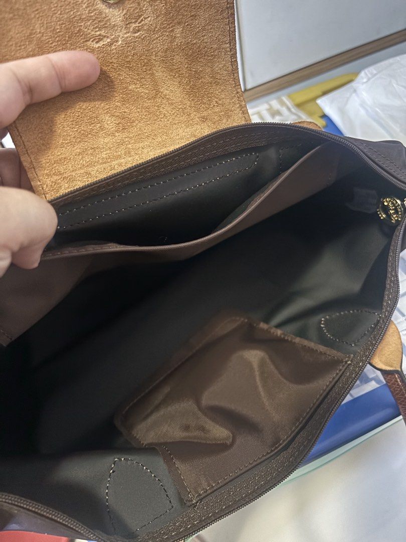 ORIGINAL & IMPORTED Longchamp Long Handle Medium Tote- Ebony (Category: Tote Bags) located in Malolos. Submitted by cheerz21 (Listing ID 1468099100, Image 3). Description: ORIGINAL & IMPORTED Longchamp Long Handle Medium Tote- Ebony Snap button Zip closure 2 inside flat pockets MINT CONDITION; Exact photos are posted Material: Canvas 26.5 cm x 28 cm x 15.5 cm 📌No return, no exchange. If in doubt, do not buy. 📌Disclaimer: Cheerz21 is not affilia