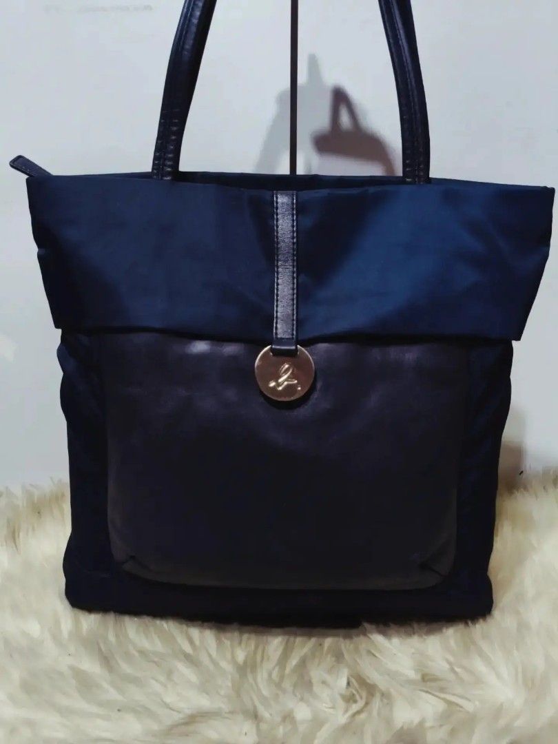 Original Agnès B. tote Bag (Category: Shoulder Bags) located in Cabuyao City. Submitted by secondhand.shop.ph (Listing ID 1468200154, Image 2). Description: Sale❗️Sale❗️Sale❗️ ₱ 2,280 Original Agnés B LIKE NEW Midnight Blue Medium-Large Nylon & genuine leather trim FLAWLESS.