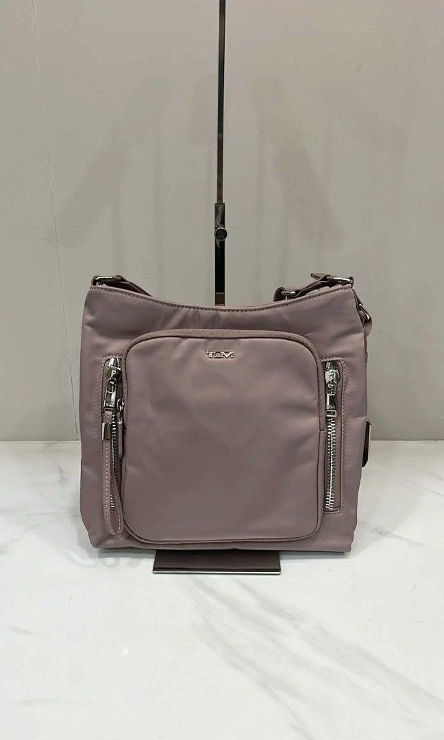 Original Tumi Sling Bag (Category: Cross-body Bags) located in Pasig City. Submitted by bolddeer_2ab1c6 (Listing ID 1468096957, Image 1). Description: Tumi sling bag. color: old rose with tracercode.