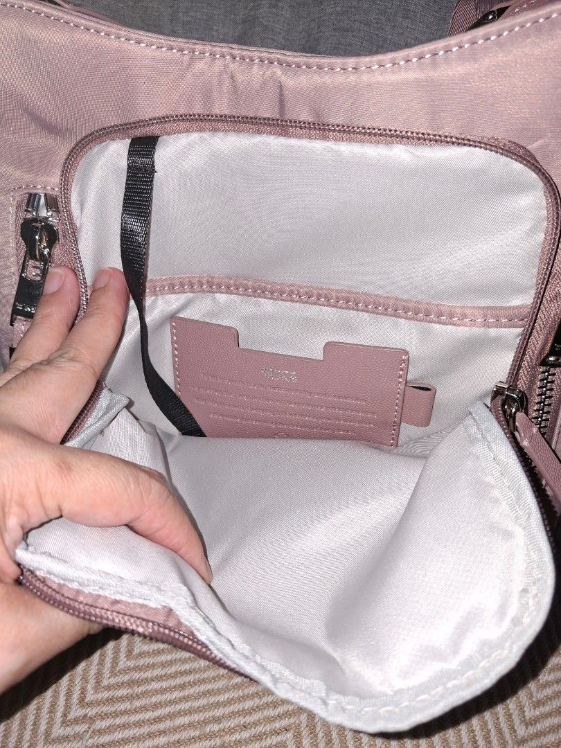 Original Tumi Sling Bag (Category: Cross-body Bags) located in Pasig City. Submitted by bolddeer_2ab1c6 (Listing ID 1468096957, Image 3). Description: Tumi sling bag. color: old rose with tracercode.