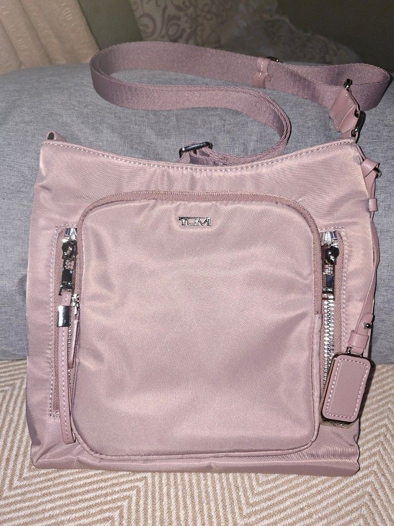 Original Tumi Sling Bag (Category: Cross-body Bags) located in Pasig City. Submitted by bolddeer_2ab1c6 (Listing ID 1468096957, Image 2). Description: Tumi sling bag. color: old rose with tracercode.