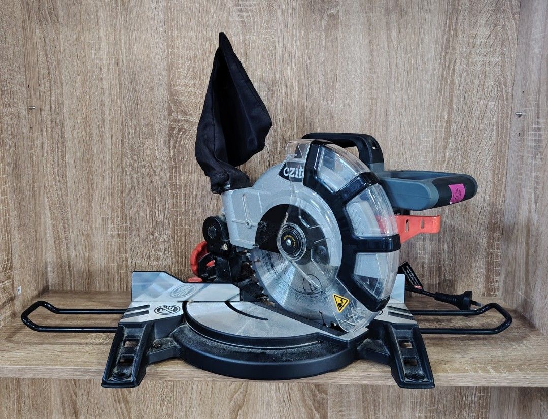 Ozito Compound Mitre Saw (Category: Construction Tools & Equipment) located in Manila. Submitted by rollysuela09206 (Listing ID 1468072705, Image 2). Description: - Brand: Ozito - Model : CMS-1621 - Compound Mitre Saw - Size : 2100mm 8" - Powers Up And Cuts Cleanly - Adjustable Fence And Clear blade guard - Dust Collection Bag And Extension Arms On Both Sides - Cord And Plug Attached - DIY Woodworking And Home Garage workshops.