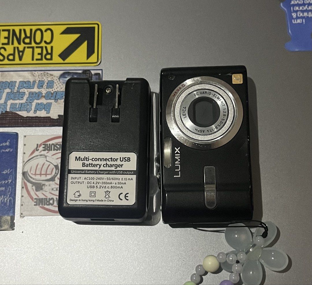 Panasonic Lumix Digicam with Charger & Case (Category: Cameras) located in Manila. Submitted by ymgucci (Listing ID 1468186430, Image 1). Description: • Brand: Panasonic Lumix Camera • Lens: Leica DC Vario-Elmarit lens • Condition: Black body with visible cosmetic scratches and wear marks from regular handling; tested and powers up fine • Does NOT come with an SD card, but comes with the battery • Included Accessories: Protective carrying case, m