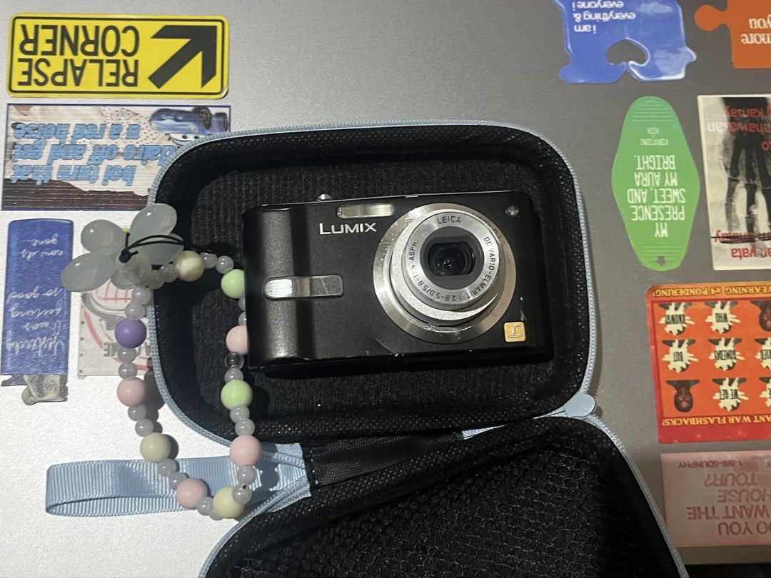 Panasonic Lumix Digicam with Charger & Case (Category: Cameras) located in Manila. Submitted by ymgucci (Listing ID 1468186430, Image 2). Description: • Brand: Panasonic Lumix Camera • Lens: Leica DC Vario-Elmarit lens • Condition: Black body with visible cosmetic scratches and wear marks from regular handling; tested and powers up fine • Does NOT come with an SD card, but comes with the battery • Included Accessories: Protective carrying case, m