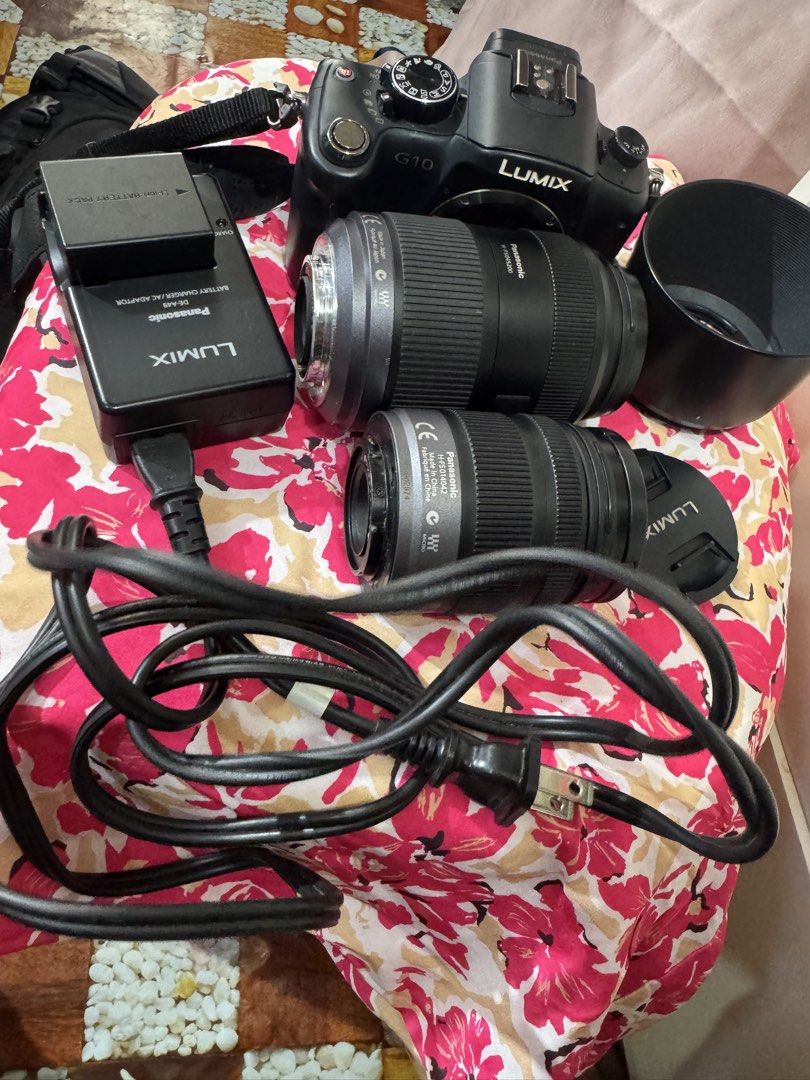 Panasonic Lumix DMC-G10 Mirrorless Camera with 2 Lenses (Category: Cameras) located in Manila. Submitted by wildbear.e10374 (Listing ID 1468094864, Image 2). Description: - Camera: Panasonic Lumix DMC-G10 mirrorless body (Black) - Lenses: Lumix G Vario 14-42mm & 45-200mm telephoto with Mega O.I.S. - Protection: Hoya UV(C) HMC filters attached to both lenses. This Camera have 2pcs lenses It’s came with Nikon Camera bag 2pcs battery And with Charge