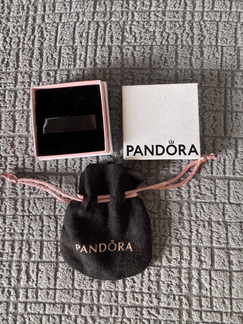 Pandora Jewelry Box and Pouch (Category: Other Accessories) located in Mandaluyong City. Submitted by axos723 (Listing ID 1468190976, Image 2). Description: ➡️Please read item description carefully below (click read more 👇) ➡️Preloved ➡️Authentic ➡️Item is AVAILABLE ➡️1-Day Reservation only ➡️First to pay gets the item ➡️For SURE BUYERS only please. -Price:380+ SF -Brand: Pandora -Color:White box and Black pouch with pink string (Color may vary 