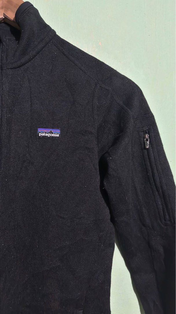 Patagonia Black Fleece Zip Jacket (Category: Coats, Jackets and Outerwear) located in Baguio. Submitted by iconicsmeti (Listing ID 1468089293, Image 3). Description: - Authentic black Patagonia fleece jacket - Full front zipper closure with a wind-blocking high collar - Convenient zippered pocket on the left sleeve - Classic embroidered Patagonia logo patch on the chest - Knit texture fabric for ultimate warmth and comfort on cooler days - Perfec