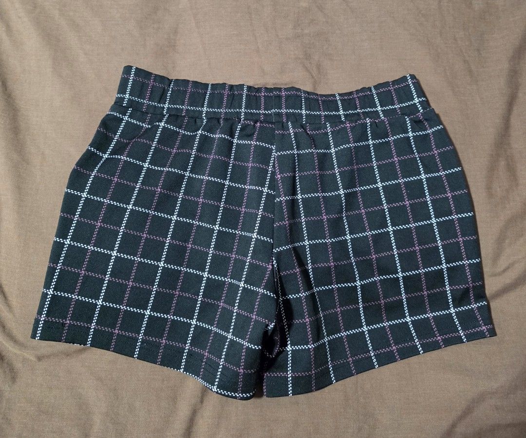 Paul Friend Plaid Shorts Size L (Category: Shorts) located in Paranaque City. Submitted by franinnashop (Listing ID 1468097403, Image 2). Description: Declutter 28 to 32 paranaque city - Brand: Paul Frank - Color: Black with white and pink plaid grid pattern - Size: L (fits waist 28 to 32 inches) - Waistband: Elastic with branded metal grommets - Details: Uncle Sam top hat patch and dollar sign graphic with 'ONEDOLLAR' text on the leg - Features: