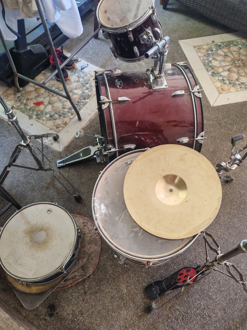 Pearl Roadshow Drum Set (Category: Musical Instruments) located in Paranaque City. Submitted by patsent (Listing ID 1468094117, Image 1). Description: Pearl Roadshow drum kit in wine red. Comes with bass drum, 2 toms, snare, -hat, stands, and pedal. Ready to play. Shows normal wear and minor oxidation. Pickup only. Price negotiable .