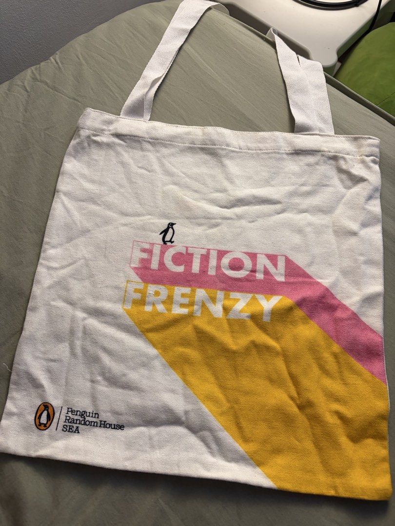 Penguin Random House SEA Tote Bag (Category: Tote Bags) located in Manila. Submitted by ajdeclutter (Listing ID 1468192300, Image 2). Description: - Authentic Penguin Random House SEA tote bag - Design: 'Certified Book Nerd' on front, 'Fiction Frenzy' on back with colorful book graphics - Condition: Clean, no stains or damage found .