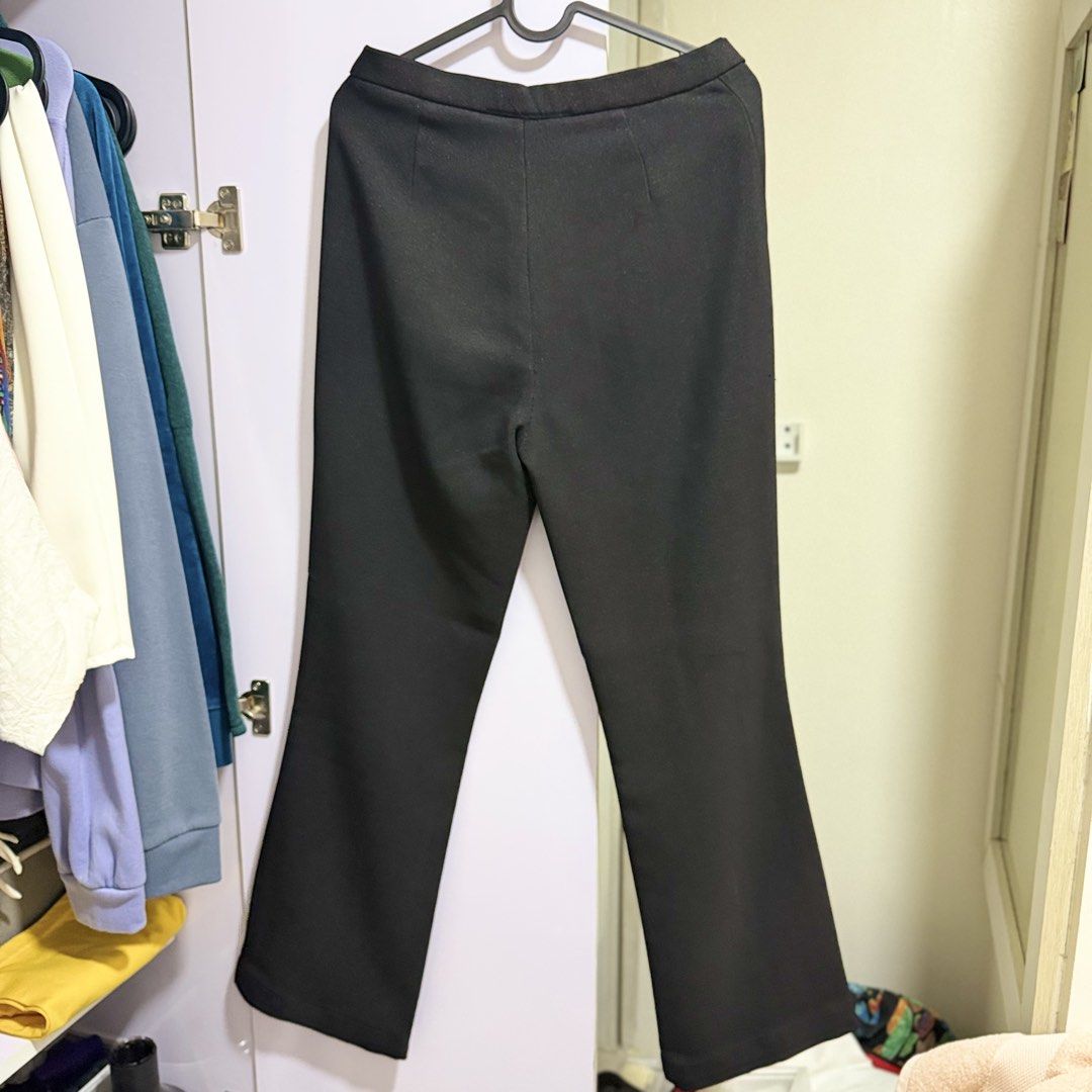 perry ellis black trousers flare pants (Category: Other Bottoms) located in Cavite. Submitted by lovedbysham (Listing ID 1468275232, Image 3). Description: - Brand: Perry Ellis - Color: Classic solid black - Design: Structured waistline with front button closure and slightly flared hem - Style: Versatile and timeless - Occasion: Perfect for both casual outings and work wear - Matching: Great basic piece that pairs easily with any top.