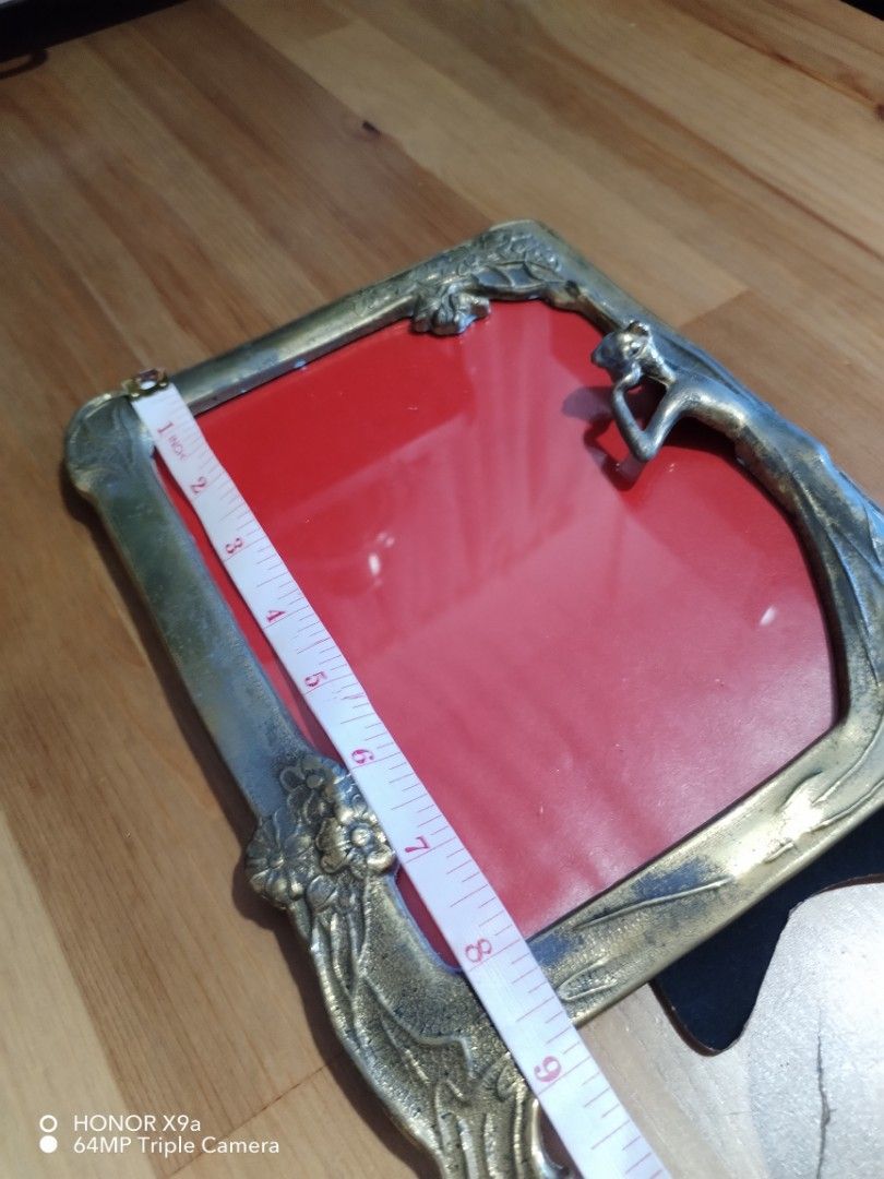 Picture Frame ( Vintage Style) (Category: Frames & Pictures) located in Muntinlupa City. Submitted by arciagamaryann68 (Listing ID 1468106466, Image 3). Description: - Vintage-style picture frame with a classic brass-finish metal design - Features an intricate Art Nouveau aesthetic with an elegant sculpted lady figure and floral accents - Equipped with a sturdy black velvet backing and adjustable support stand - Ideal for tabletop or desk display