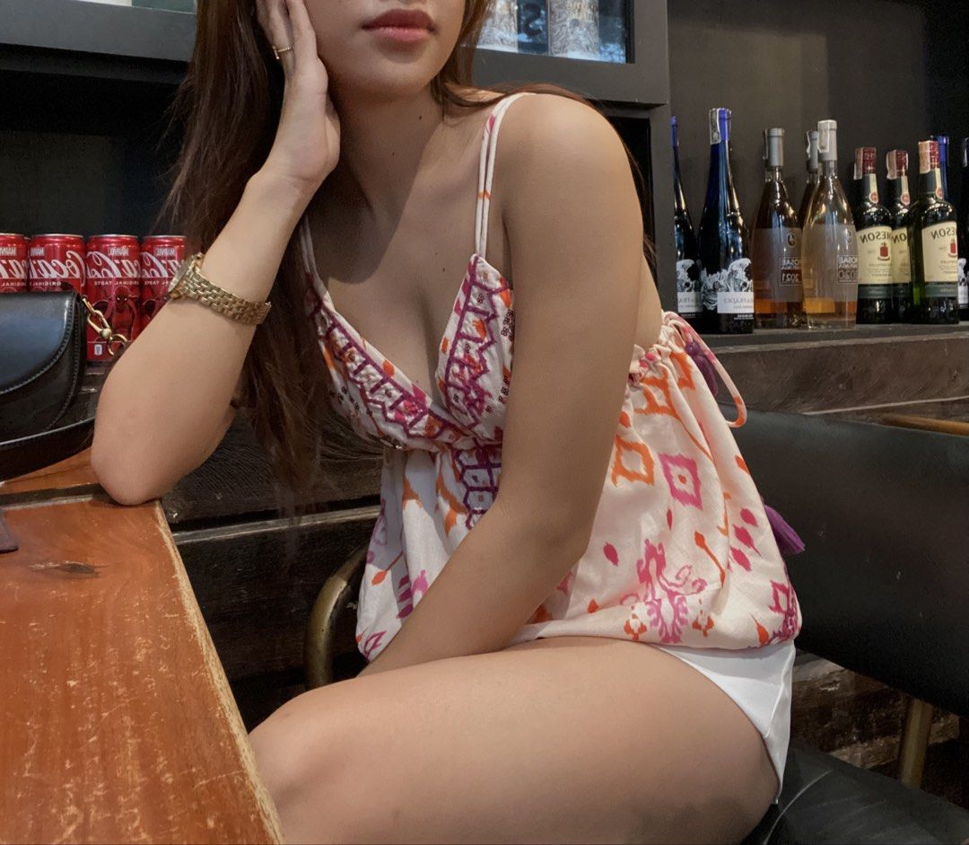 Pink and Orange Patterned Spaghetti Strap Camisole Top (Category: Sleeveless) located in Manila. Submitted by saudadeee (Listing ID 1468102393, Image 3). Description: - Style: Sleeveless cami with a flattering flowy fit - Design: Vibrant pink, orange, and purple geometric pattern - Details: Deep V-neckline and thin adjustable spaghetti straps - Material: Lightweight fabric, perfect for hot weather - Versatility: Easy to pair with white shorts or 