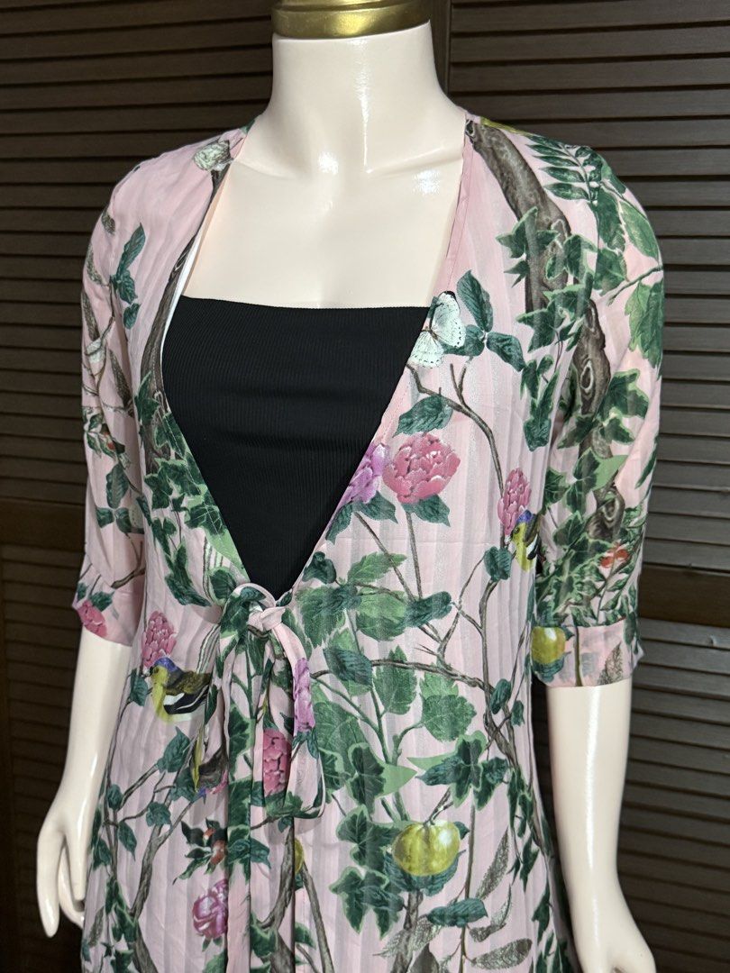 Pink Floral Tree Print Tie-Front Cardigan (Category: Coats, Jackets and Outerwear) located in Santiago. Submitted by jy.collection (Listing ID 1468089451, Image 2). Description: - Color/Design: Pink with all-over tree and flower print - Sleeves: Half sleeves - Closure: Front tie closure with long straps - Material: Soft, sheer fabric - Styling: Great layering piece over basic tops - Condition: Excellent / Pre-loved (ready to wear).