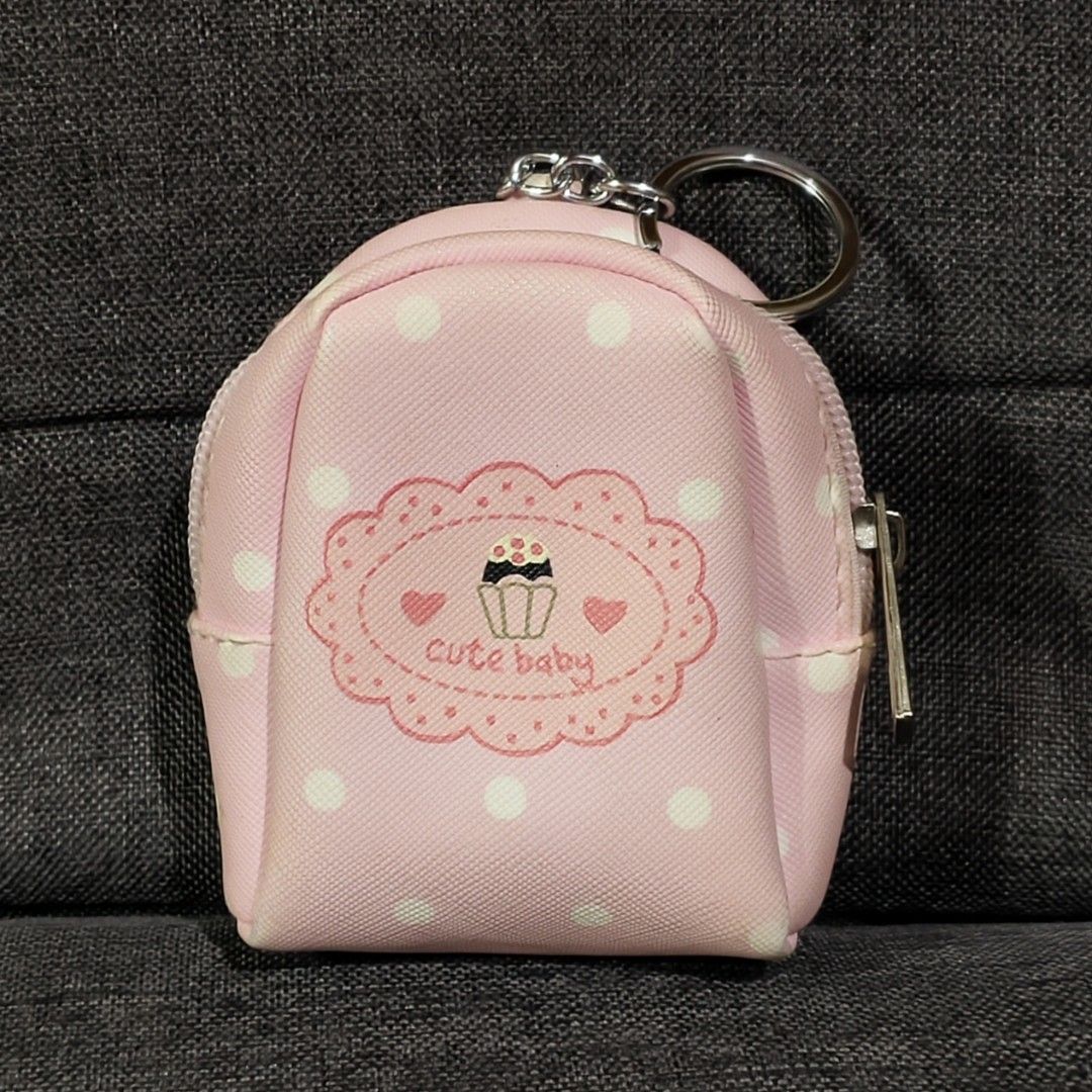 pink polka-dot mini backpack coin purse keychai (Category: Wallets & Card holders) located in Bulacan. Submitted by angel.decluttersx (Listing ID 1468271179, Image 1). Description: rfs: not my style.