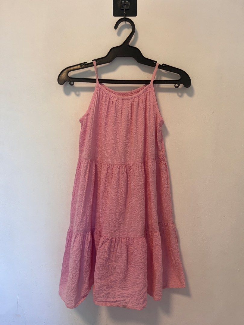 Pink Spaghetti Strap Tiered Dress (Category: Babies & Kids Fashion) located in Manila. Submitted by yliahdreye52249 (Listing ID 1468097863, Image 1). Description: - Color: Bright pink - Design: Thin straps with a simple scoop neckline - Details: Textured fabric with 3 playful ruffled tiers - Style: Easy slip-on design - Perfect for: Warm weather, beach trips, or casual outings.