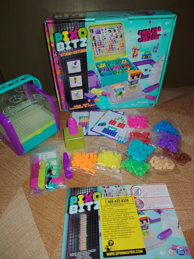 Pixobitz Studio Water Fuse Beads Craft Kit (Category: Craft Supplies & Tools) located in Santiago. Submitted by aceheart0118672 (Listing ID 1468178506, Image 1). Description: - Pixobitz Studio 3D water fuse bead kit for kids - Includes colorful bead packs, templates, spray bottle, tools, and storage case - Original box and instruction booklet included - Fun and engaging creative activity.