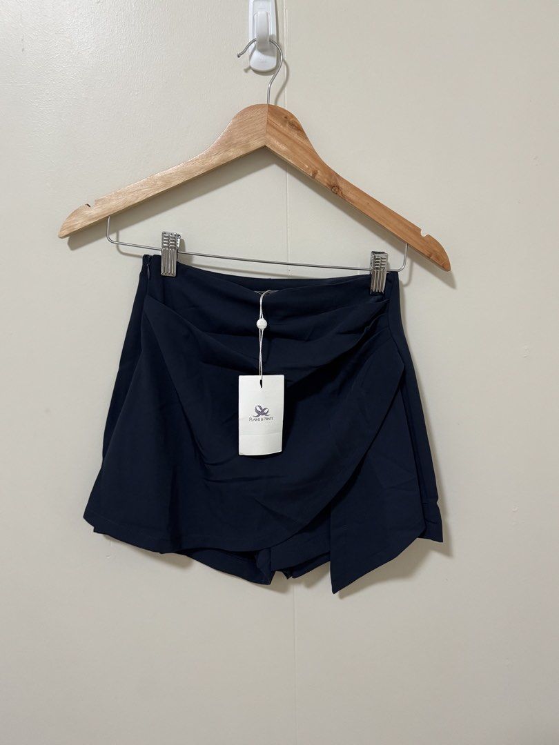 Plains & Prints Jolie Skort Navy XS (Category: Skirts) located in Manila. Submitted by gotlistedph (Listing ID 1468209864, Image 1). Description: - Brand: Plains & Prints - Style: Jolie Skort (Wrap-front skirt look with shorts underneath) - Color: Navy Blue - Size: XS / UK 6 / US 2 - Closure: Side zip - Condition: Brand new with original retail tags - Original Price: PHP 1,798.00.