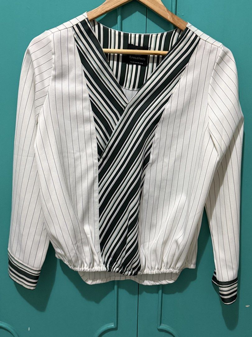 Plains & Prints White and Green Striped Blouse (Category: Blouses) located in Mandaluyong City. Submitted by ecowarriorph (Listing ID 1468251844, Image 1). Description: - Brand: Plains & Prints - Design: White with green & black vertical stripes - Details: Long sleeves with button cuffs, V-neckline with contrasting crossover panels, elasticated back hem - Size: PHL M (EUR 10, USA 6) - Condition: No flaws. In excellent condition. RFS: Decluttering