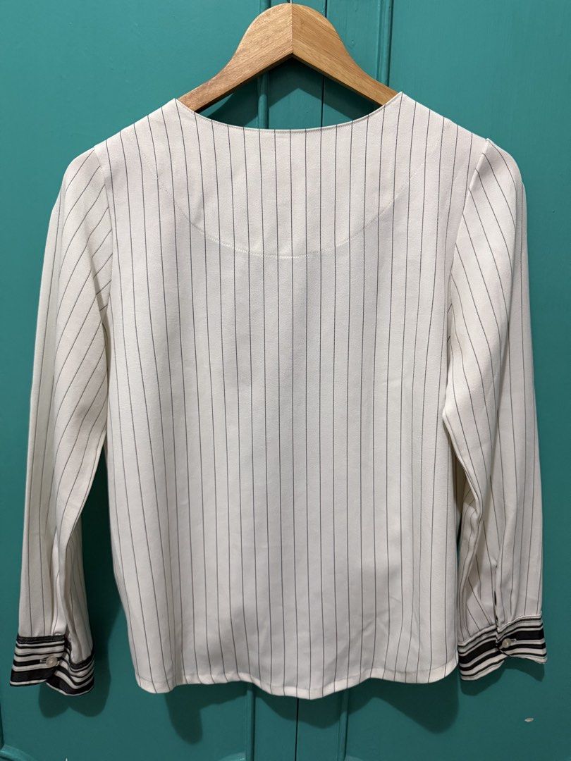 Plains & Prints White and Green Striped Blouse (Category: Blouses) located in Mandaluyong City. Submitted by ecowarriorph (Listing ID 1468251844, Image 3). Description: - Brand: Plains & Prints - Design: White with green & black vertical stripes - Details: Long sleeves with button cuffs, V-neckline with contrasting crossover panels, elasticated back hem - Size: PHL M (EUR 10, USA 6) - Condition: No flaws. In excellent condition. RFS: Decluttering