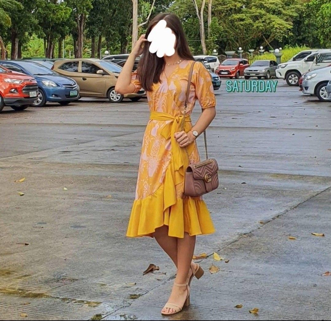 Plains & Prints Yellow Wrap Dress (Category: Dresses) located in Angeles City. Submitted by leichen57360 (Listing ID 1468104079, Image 1). Description: - Brand: Plains & Prints - Color: Yellow with white botanical/vase print - Style: Wrap dress with short sleeves, V-neckline, tie waist sash, and ruffled hem - Size: PH S, UK 8, US 4 - Condition: Pre-loved, well-maintained.