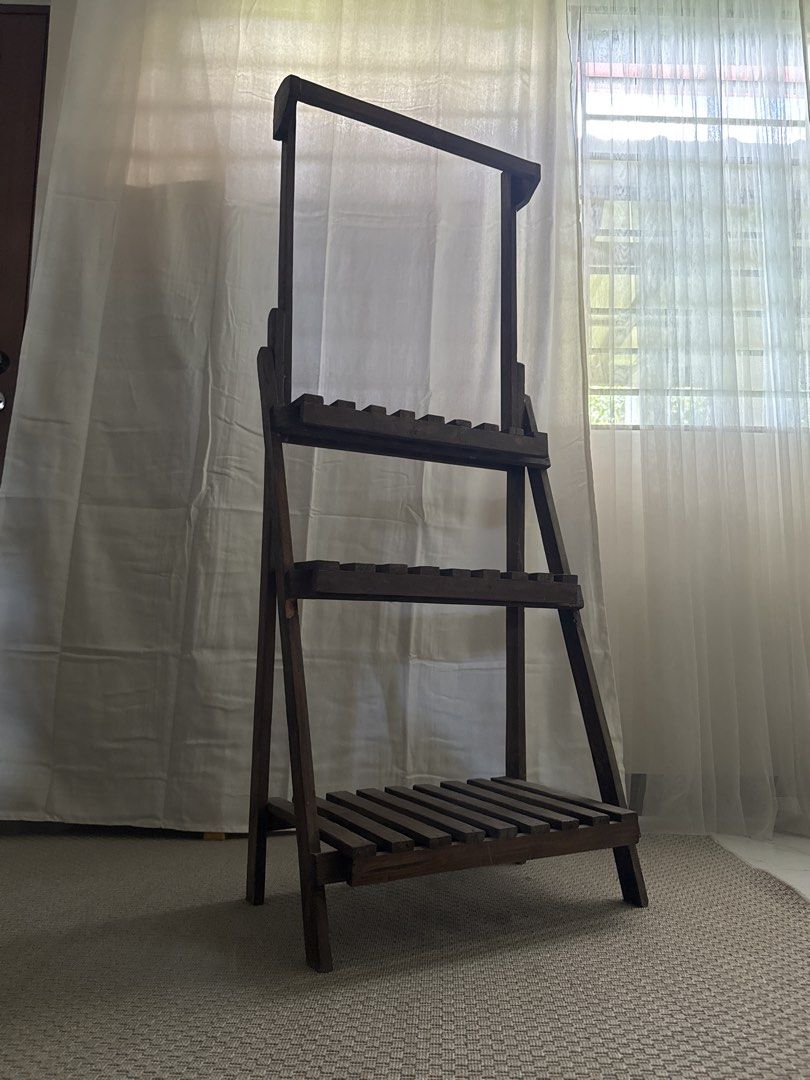 Plant Display Shelves (Category: Shelves, Cabinets & Racks) located in Marikina City. Submitted by repurpose_studio (Listing ID 1468113803, Image 3). Description: - Type: Freestanding A-frame wooden shelf unit - Storage: 3 slatted shelves for storage or display - Extra Feature: Top horizontal bar ideal for Vine plants - Condition: Excellent / Ready to use - Perfect for indoor plants display reason for selling - not in use and will move out.