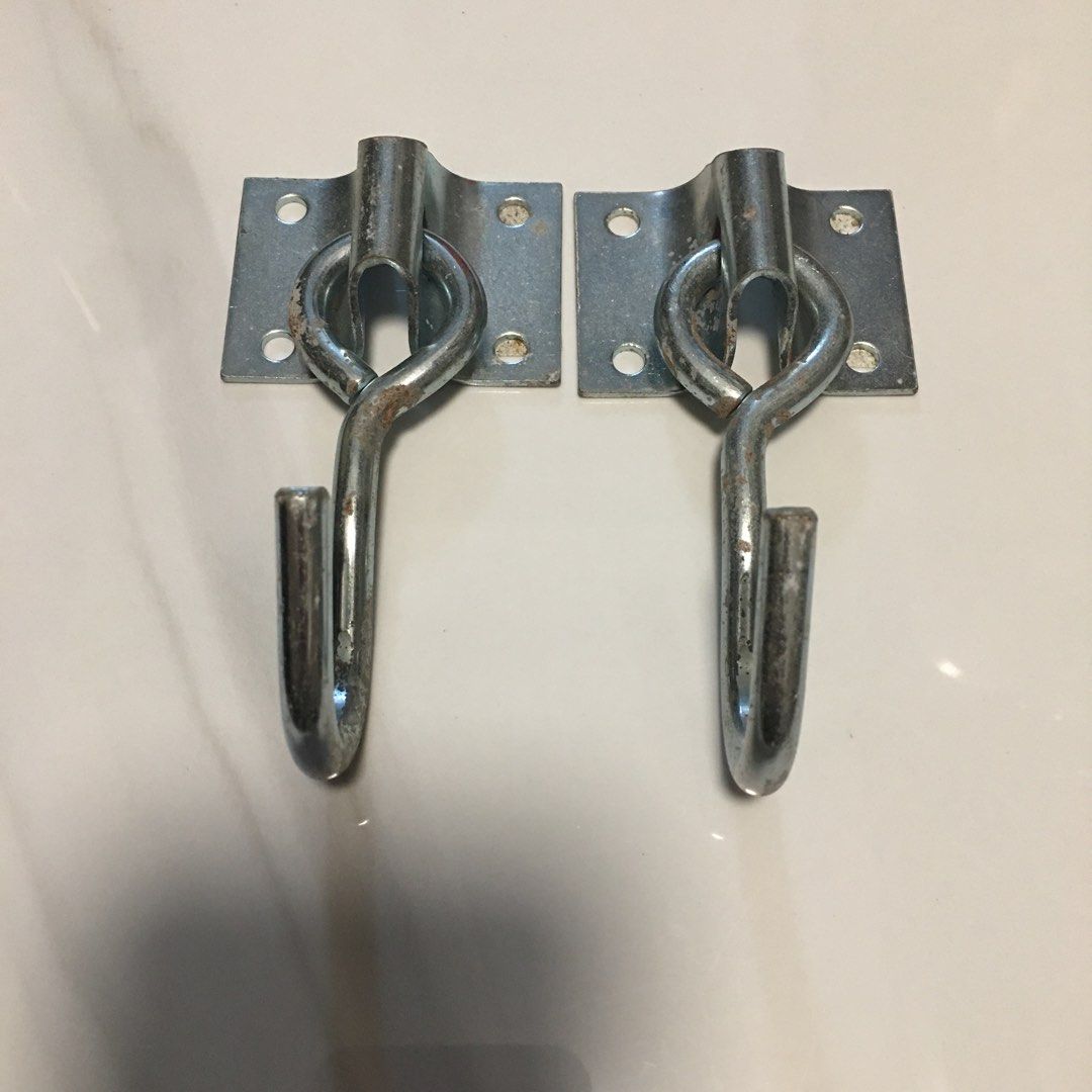 Plate hanging hooks ceiling wall mount heavy duty hooks (Category: Hooks & Hangers) located in Pasay City. Submitted by gilbertso62551 (Listing ID 1468148059, Image 1). Description: - Set of 2 sturdy steel J-shaped hanging hooks - Base plates feature 4 screw holes each for secure wall mounting - Versatile use for hanging plants, tools, and household items - Condition: Minor rust spotting from storage, Japanese label on the back - Perfect for orga