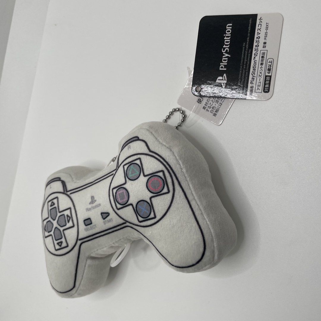 PlayStation Controller Mini Plush Mascot Keychain PS25-02XT (Category: Plushies & Soft Toys) located in Mandaluyong City. Submitted by akihabara48 (Listing ID 1468135869, Image 3). Description: - Official Sony Interactive Entertainment PlayStation controller pull-string plush mascot (Model: PS25-02XT, 2025 release) - Adorable retro design in white with printed classic buttons, D-pad, and PlayStation branding - Includes a convenient silver ball ch