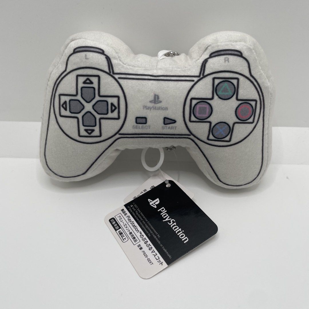 PlayStation Controller Mini Plush Mascot Keychain PS25-02XT (Category: Plushies & Soft Toys) located in Mandaluyong City. Submitted by akihabara48 (Listing ID 1468135869, Image 1). Description: - Official Sony Interactive Entertainment PlayStation controller pull-string plush mascot (Model: PS25-02XT, 2025 release) - Adorable retro design in white with printed classic buttons, D-pad, and PlayStation branding - Includes a convenient silver ball ch