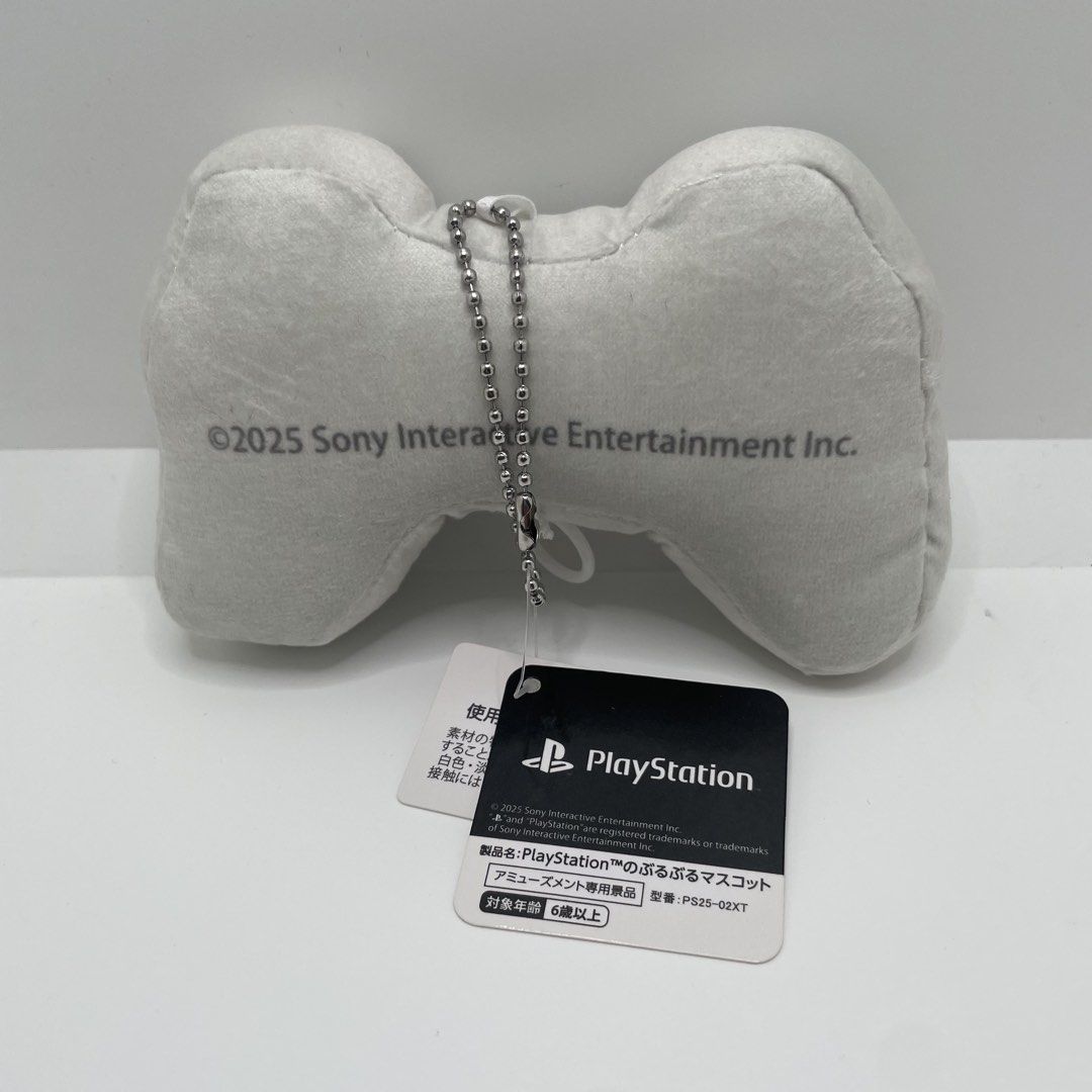 PlayStation Controller Mini Plush Mascot Keychain PS25-02XT (Category: Plushies & Soft Toys) located in Mandaluyong City. Submitted by akihabara48 (Listing ID 1468135869, Image 2). Description: - Official Sony Interactive Entertainment PlayStation controller pull-string plush mascot (Model: PS25-02XT, 2025 release) - Adorable retro design in white with printed classic buttons, D-pad, and PlayStation branding - Includes a convenient silver ball ch