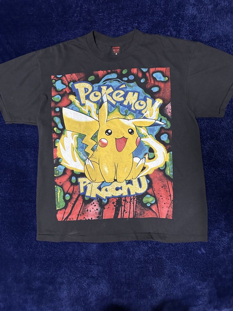 Pokemon T-Shirt ft. Pokemon & Team Rocket (Category: Tshirts & Polo Shirts ) located in Quezon City. Submitted by rackculture (Listing ID 1468070024, Image 1). Description: 👕 Size XLarge 23 width 29.5 length 🧵Single Stitch All The Way 🏷️ Fashion Victim on Tag ₱ 1,500 only 📩 Message us to order .
